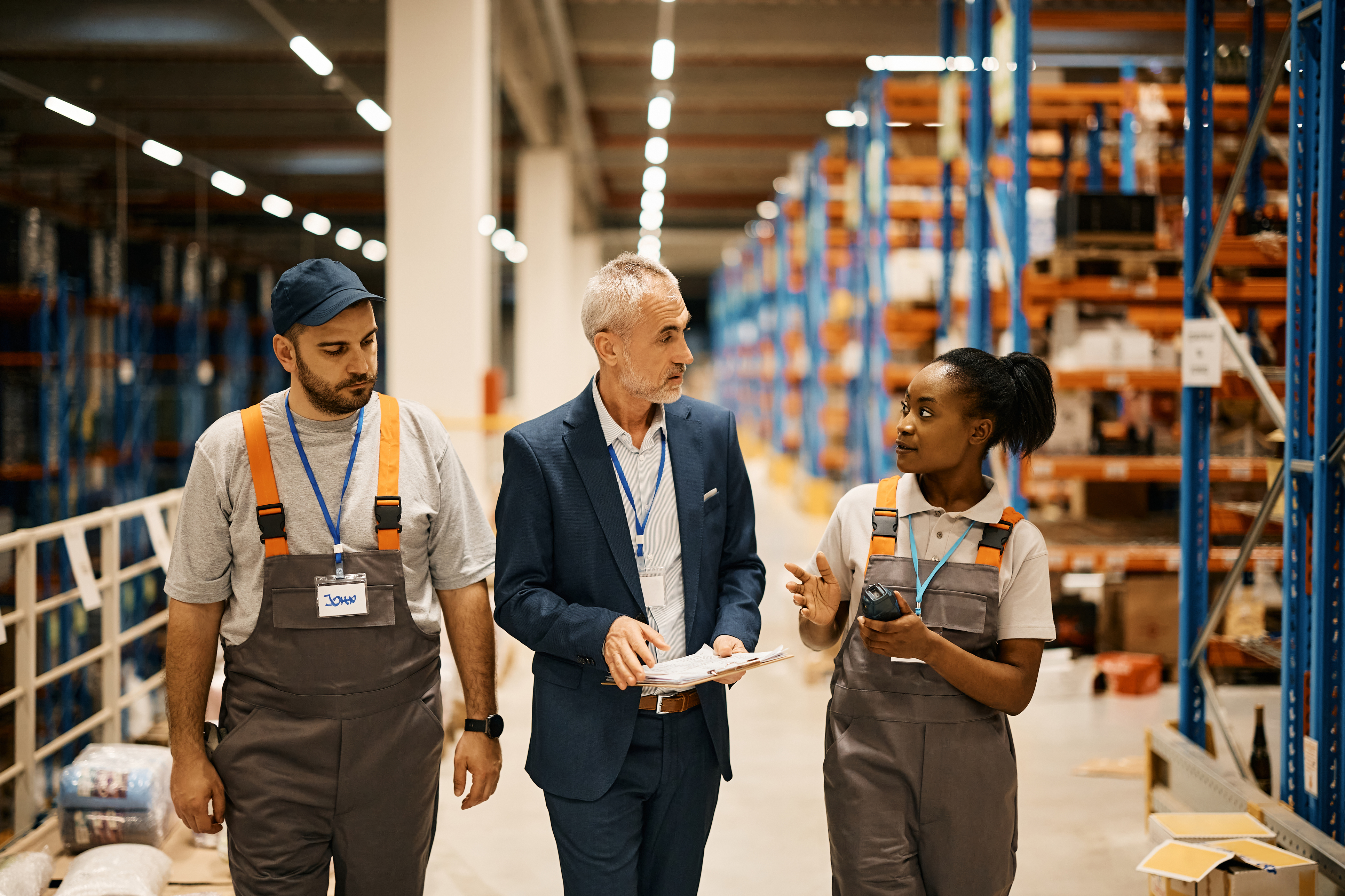 Warehouse employees walk and talk