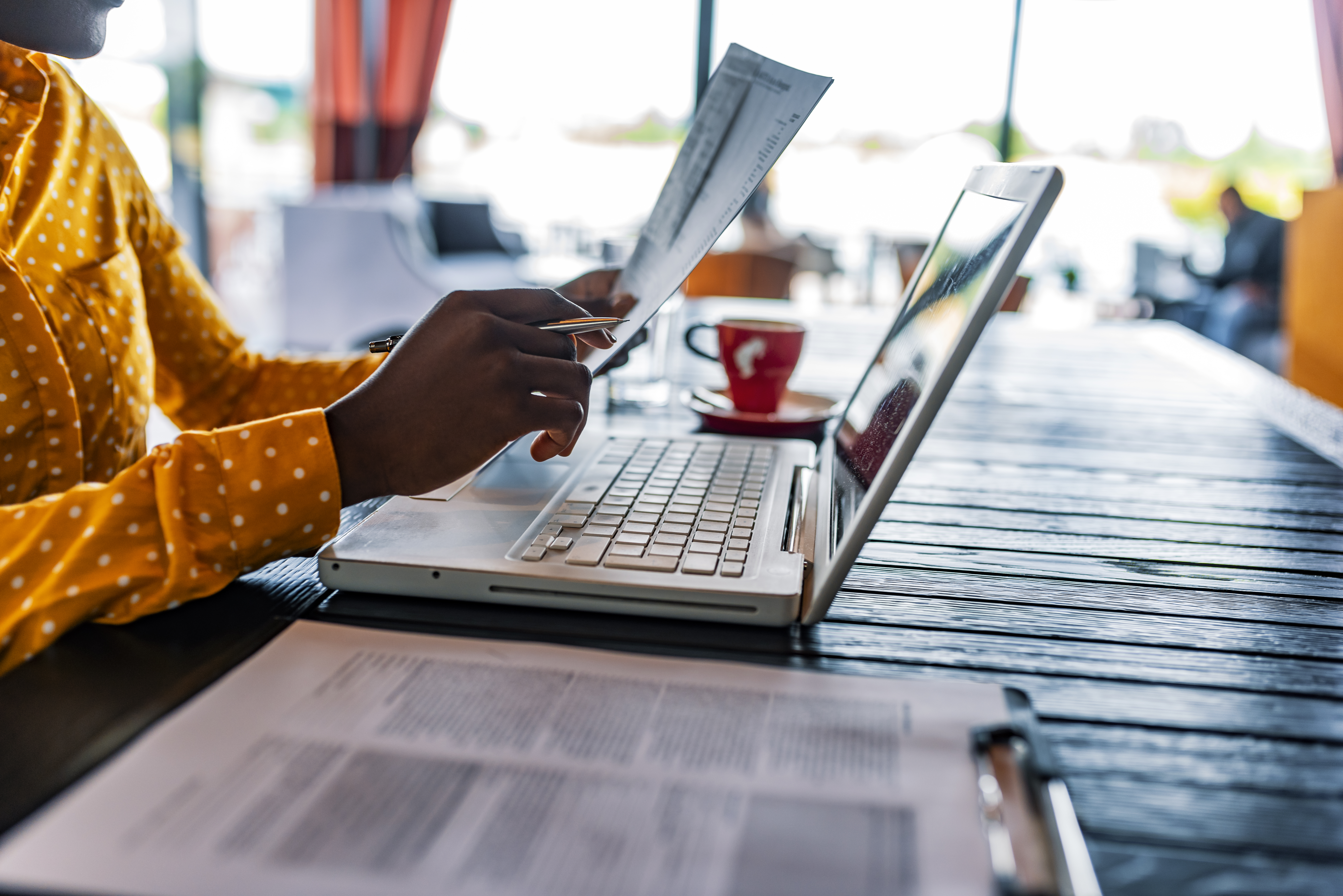Small business owner reviewing insurance documents