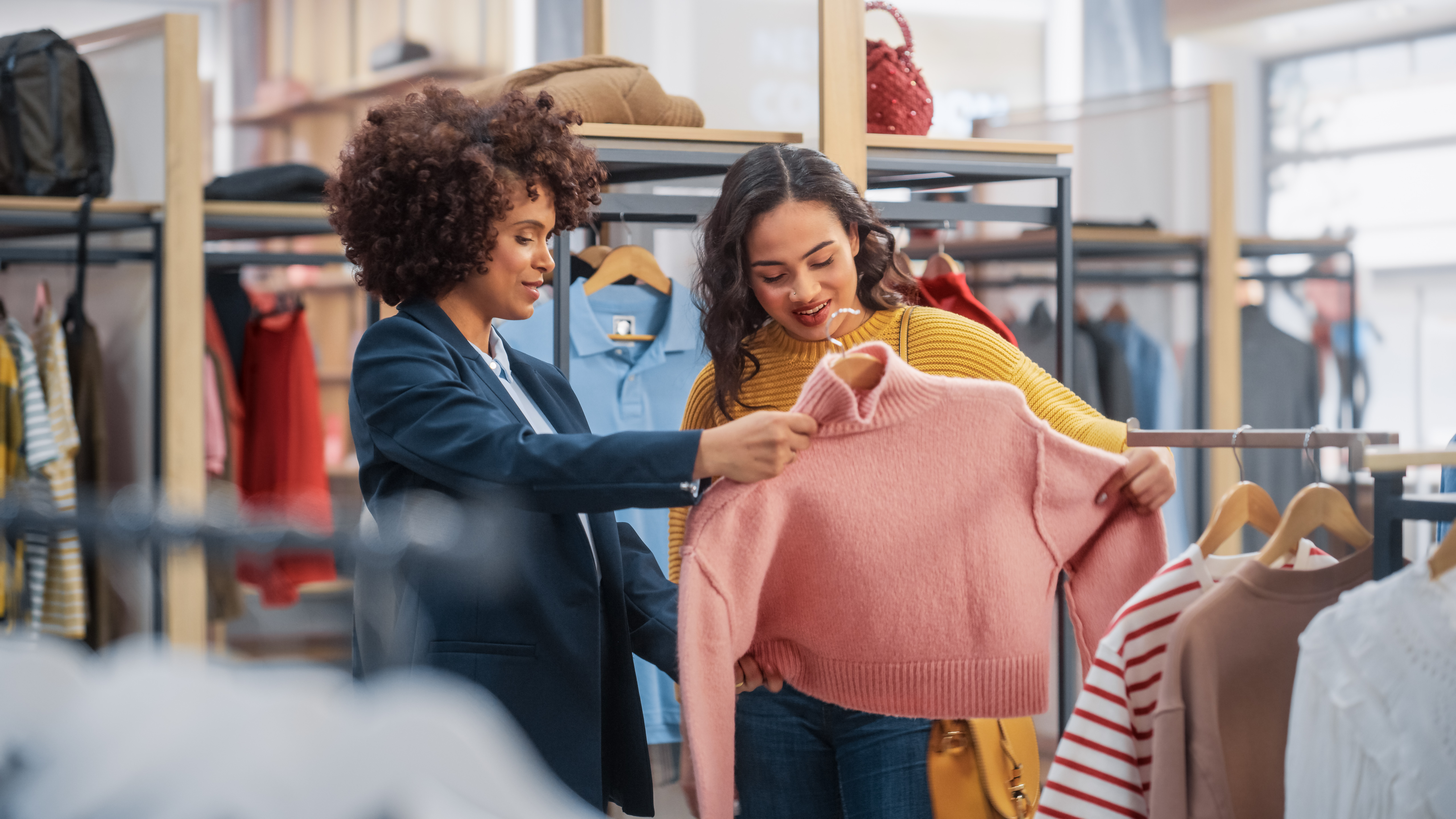 Retail worker helping customer