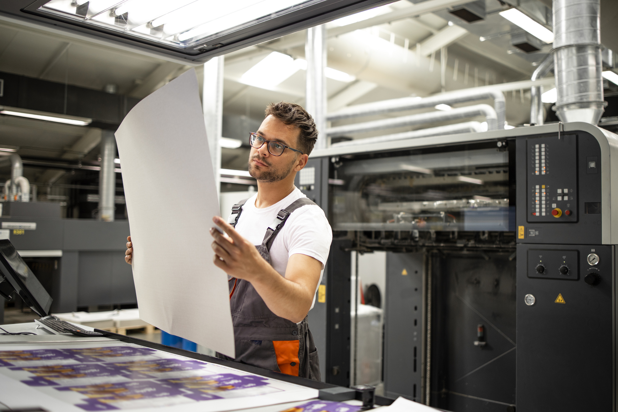 Man looking at printed material