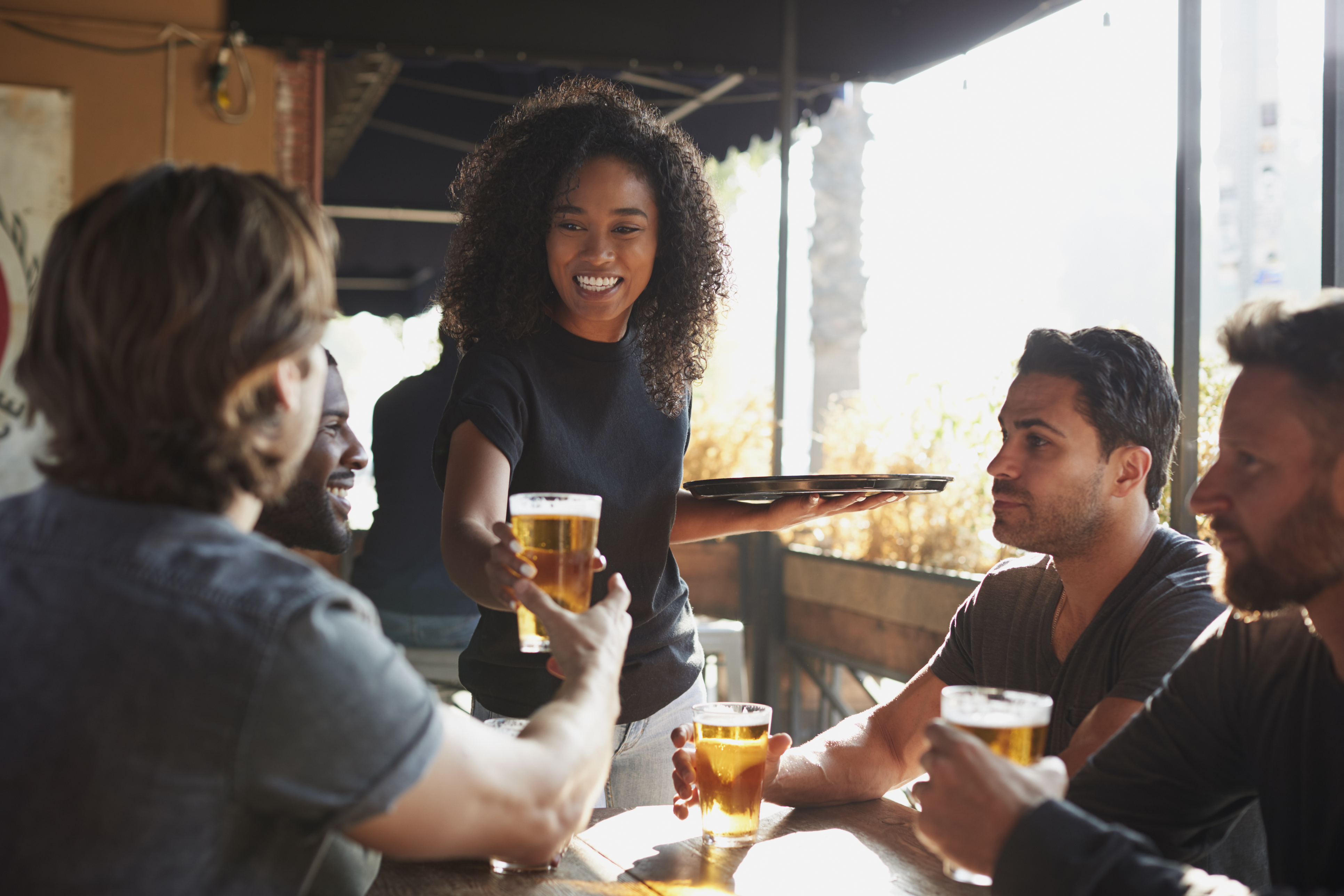 Woman serving beverage