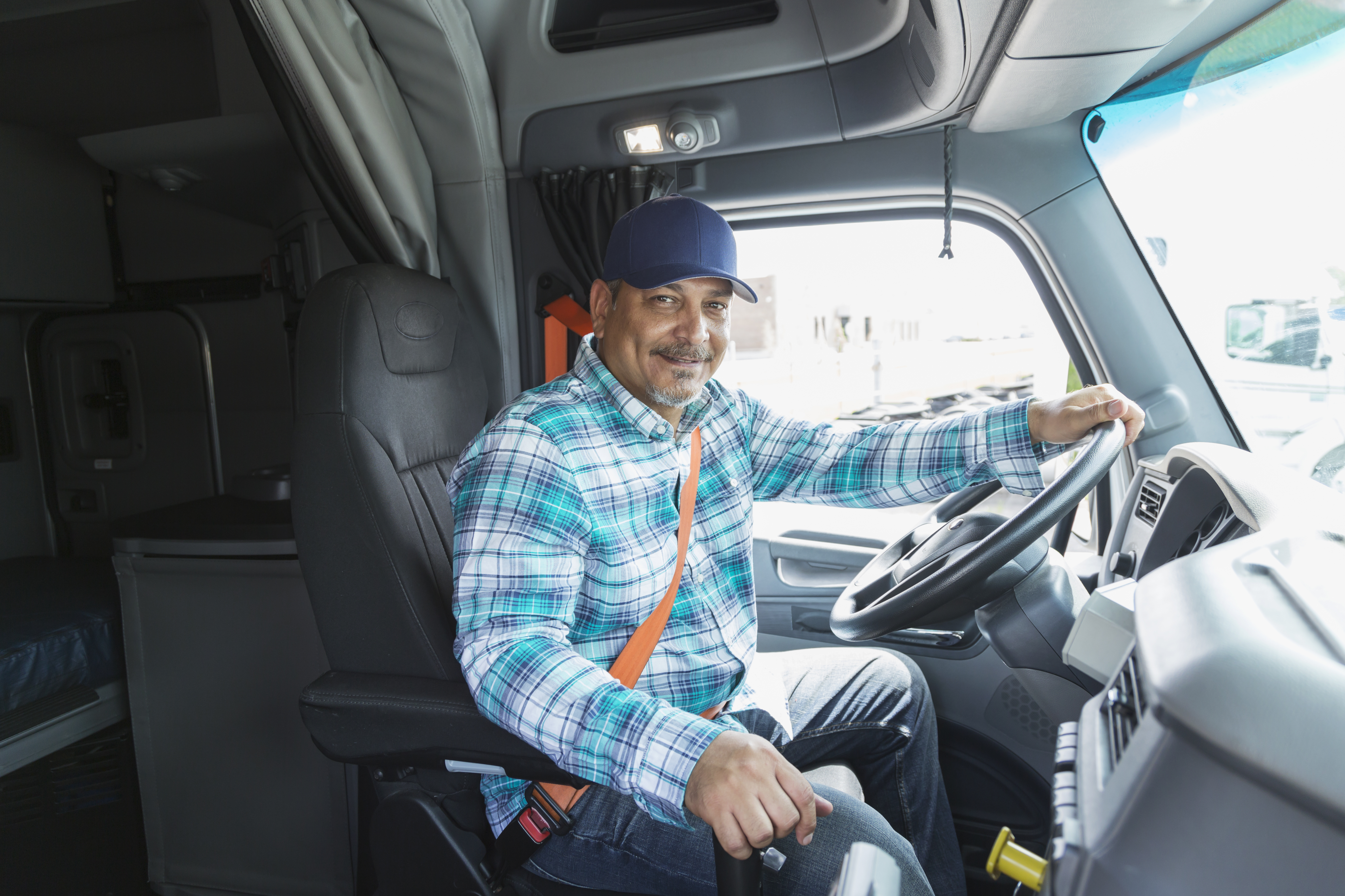 Man in the driver seat of a semi-truck