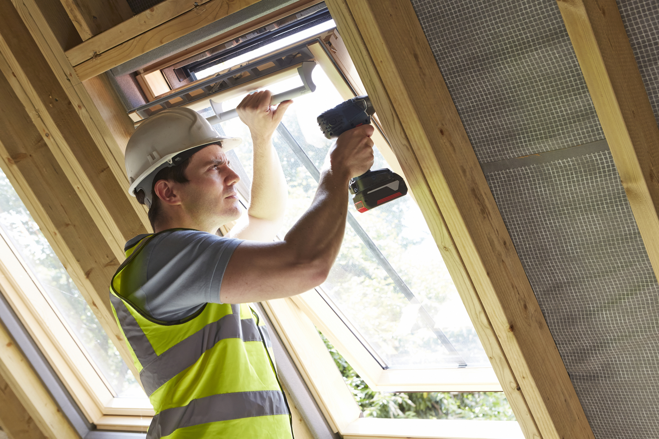 Contractor construction worker installing window