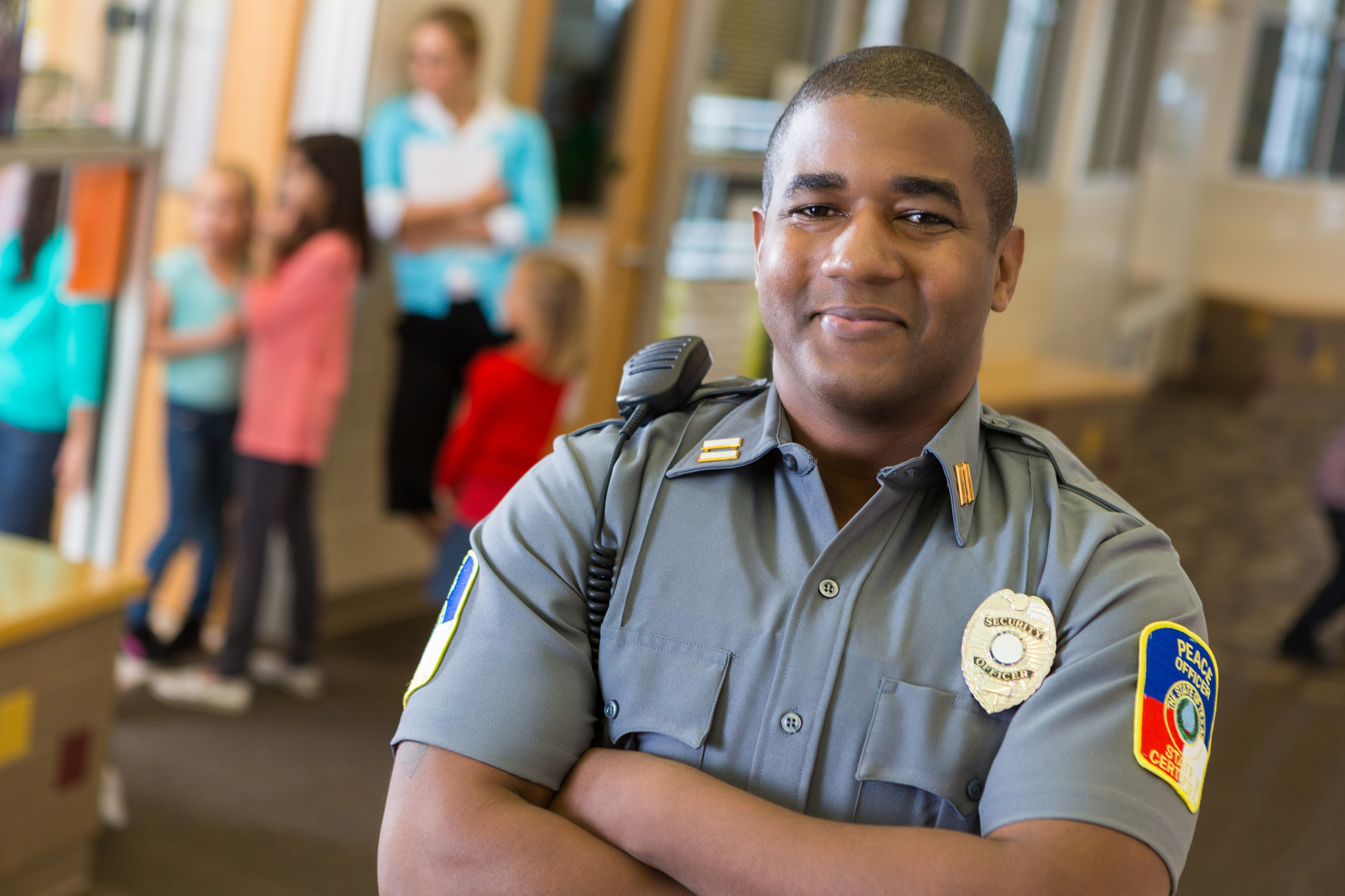Happy security guy with radio and badge