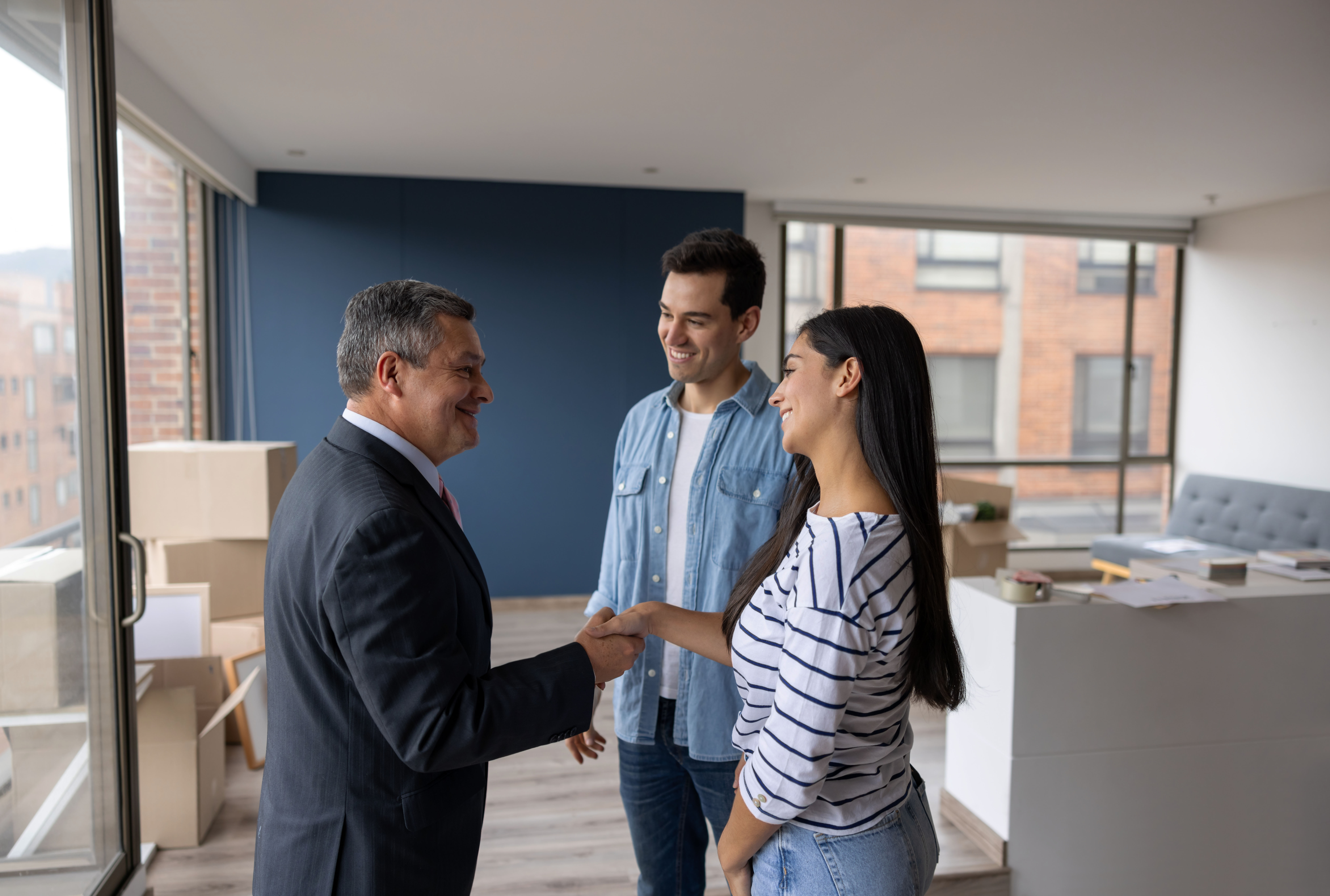 Young couple meets an older man at a house