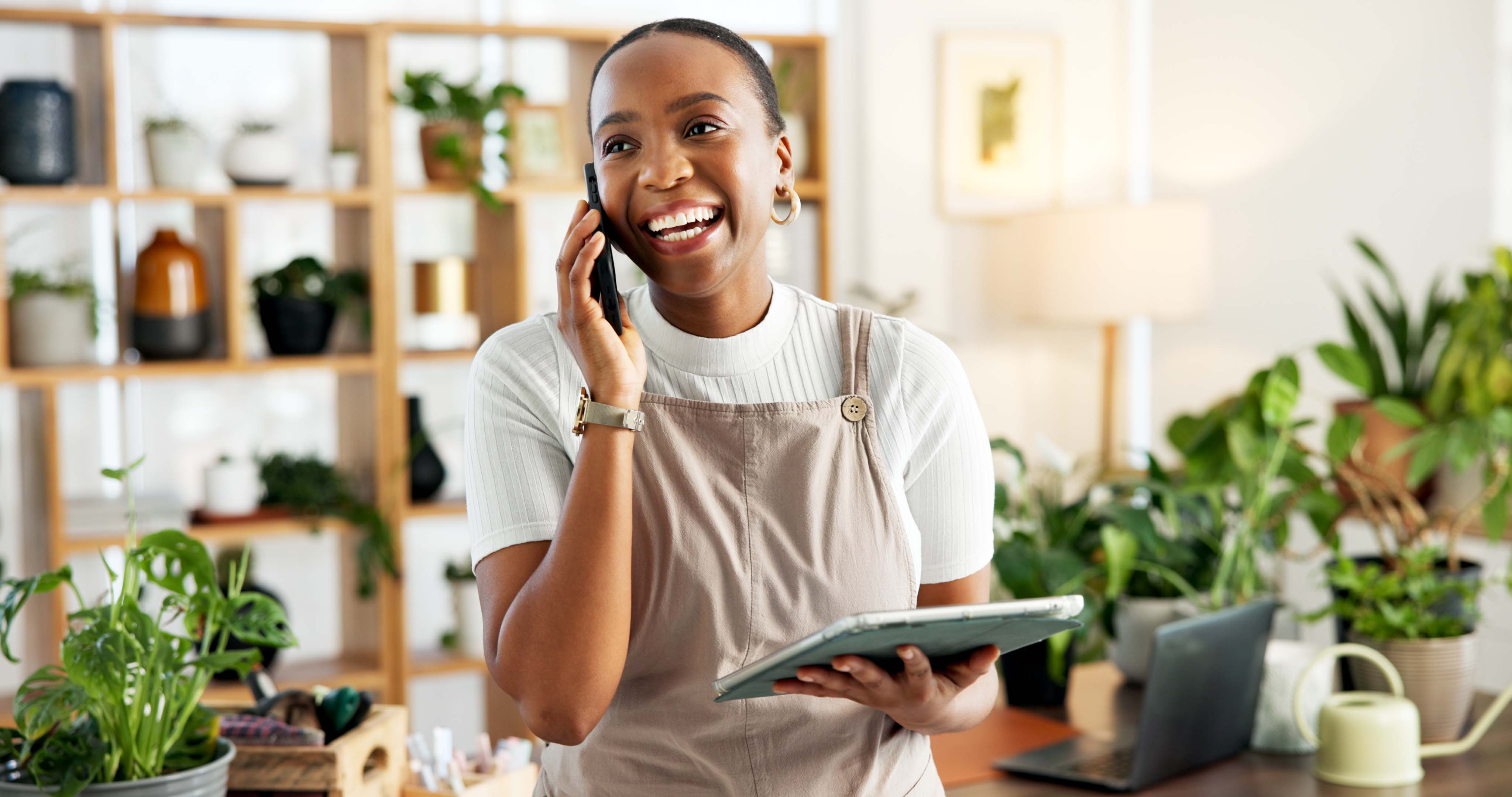 woman florist in office for online order confirmation